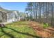 A beautifully landscaped backyard with a privacy fence, offering a serene outdoor space for leisure and enjoyment at 1078 Amarose Ln, Marietta, GA 30066