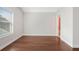 A bedroom featuring a light gray walls, hardwood floors, and a window bringing in natural light at 1078 Amarose Ln, Marietta, GA 30066