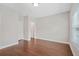 Empty bedroom featuring hardwood floors and a view of outside at 1078 Amarose Ln, Marietta, GA 30066