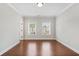 Bright bedroom with hardwood floors, natural light, and neutral wall color creating a peaceful retreat at 1078 Amarose Ln, Marietta, GA 30066