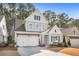 Charming two-story home features a two-car garage, grey siding and black shutters at 1078 Amarose Ln, Marietta, GA 30066