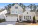 Charming two-story home features a two-car garage, grey siding and black shutters at 1078 Amarose Ln, Marietta, GA 30066