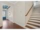 Inviting foyer featuring hardwood floors, staircase, and a glimpse of an elegantly decorated living space at 1078 Amarose Ln, Marietta, GA 30066