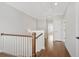 Upstairs hallway with hardwood floors and white trim at 1078 Amarose Ln, Marietta, GA 30066