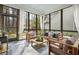 Bright sunroom showcasing a seating area with stylish furniture and view of the backyard at 1078 Amarose Ln, Marietta, GA 30066