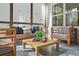 Cozy sunroom with modern furniture, patterned tile flooring, and natural light streaming in at 1078 Amarose Ln, Marietta, GA 30066