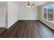 Bedroom with hardwood floors, crown moulding and a large window at 149 Fishers Mill Dr, Mcdonough, GA 30252