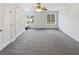 Large bedroom offering natural light, gray carpet and closet storage at 149 Fishers Mill Dr, Mcdonough, GA 30252