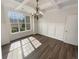 Dining room featuring wainscoting detail, chandelier, and large windows at 149 Fishers Mill Dr, Mcdonough, GA 30252