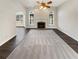 Bright living room with fireplace, arch windows, and dark floors at 149 Fishers Mill Dr, Mcdonough, GA 30252