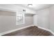 Bedroom features wood-look floors, a large window for natural light, and neutral walls, a calming retreat at 174 Howard Nw St, Atlanta, GA 30314