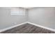 Bedroom with wood-look floors, window and neutral walls, a comfortable retreat at 174 Howard Nw St, Atlanta, GA 30314