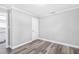 Bedroom with neutral paint, new vinyl flooring, and a door leading to other rooms at 174 Howard Nw St, Atlanta, GA 30314