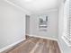 Bright bedroom featuring wood-look floors and fresh neutral paint at 174 Howard Nw St, Atlanta, GA 30314