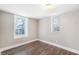 Cozy bedroom with wood-look flooring and natural light streaming through the windows, creating a serene space at 174 Howard Nw St, Atlanta, GA 30314