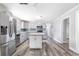 Modern kitchen with island, stainless appliances, and open layout at 174 Howard Nw St, Atlanta, GA 30314