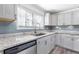 Modern kitchen showcasing granite counters and subway tile backsplash at 174 Howard Nw St, Atlanta, GA 30314