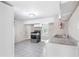 Functional kitchen includes stainless steel sink, oven, and ample counter space, perfect for easy meal prep at 174 Howard Nw St, Atlanta, GA 30314