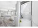 A stacked washer and dryer with nearby open living space, ideal for convenient laundry access at 174 Howard Nw St, Atlanta, GA 30314