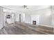 Spacious living area connects to modern kitchen with a stone fireplace at 174 Howard Nw St, Atlanta, GA 30314