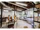 Unfinished basement with exposed pipes, lighting, and storage shelves at 1834 Buckeye Sw St, Atlanta, GA 30310