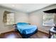 Bedroom featuring hardwood floors and natural light from two windows at 1834 Buckeye Sw St, Atlanta, GA 30310