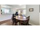 Open dining area with hardwood floors adjacent to the living room and kitchen at 1834 Buckeye Sw St, Atlanta, GA 30310