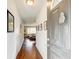 Light and bright entryway leading to an open-concept living area with hardwood floors and art at 1834 Buckeye Sw St, Atlanta, GA 30310