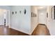 Inviting entryway featuring hardwood floors and neutral walls with decorative art at 1834 Buckeye Sw St, Atlanta, GA 30310