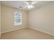 Neutral bedroom with standard ceiling fan and window at 184 Darbys Crossing Ct, Hiram, GA 30141