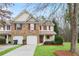 Charming townhouse with a well-manicured lawn and attached one-car garages at 184 Darbys Crossing Ct, Hiram, GA 30141