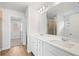 Bright bathroom with double sinks and a large mirror, as well as view into the separate shower at 7164 Brushwood Bend (Lot 111), Lithonia, GA 30058