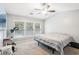 This bedroom is a cozy retreat featuring neutral colors and natural light from the multiple windows at 7717 Bellmist Dr, Fairburn, GA 30213