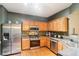 Well-equipped kitchen with stainless steel appliances and plenty of counter space at 7717 Bellmist Dr, Fairburn, GA 30213