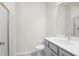 Modern bathroom featuring a light-grey vanity with a white countertop and a walk-in shower at 1733 Lansmere Sw St, Marietta, GA 30008