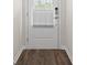 Entry way with wood floors and a security door at 1733 Lansmere Sw St, Marietta, GA 30008
