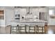 A kitchen island with stone countertops, stainless steel appliances, and hardwood floors at 1733 Lansmere Sw St, Marietta, GA 30008