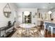 Bright dining area with marble table and view to the kitchen at 420 Rammel Oaks Dr, Avondale Estates, GA 30002