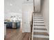 View of kitchen with stainless steel appliances, eat in kitchen, and stairway at 4200 Cavalier Way, Duluth, GA 30097
