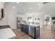 Modern kitchen with an island and stainless steel appliances and an adjacent Gathering room at 4200 Cavalier Way, Duluth, GA 30097