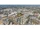 This aerial view features the community layout, nearby businesses, and surrounding wooded areas at 475 Rowes Cir, Alpharetta, GA 30009