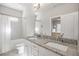 Bathroom featuring a double sink vanity with granite counters, a tub, and a shower with white and gray tiling at 475 Rowes Cir, Alpharetta, GA 30009