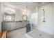 Beautiful bathroom with double vanity, a large shower with glass doors, and bright lighting at 475 Rowes Cir, Alpharetta, GA 30009