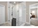 Luxurious shower with glass door and white subway tiles, blending style with modern design at 475 Rowes Cir, Alpharetta, GA 30009