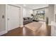 Bright bonus room with hardwood floors, a pull out couch and a treadmill with views to the backyard at 475 Rowes Cir, Alpharetta, GA 30009