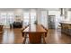 Spacious dining area adjacent to the kitchen, featuring an extended table at 475 Rowes Cir, Alpharetta, GA 30009