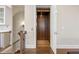 A modern home elevator features rich wood paneling and flooring for easy and accessible living at 475 Rowes Cir, Alpharetta, GA 30009