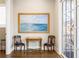 Hallway with hardwood floors, ocean painting and chairs at 475 Rowes Cir, Alpharetta, GA 30009