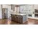 Modern kitchen with stainless steel appliances, granite countertops, and a center island at 475 Rowes Cir, Alpharetta, GA 30009
