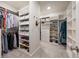 Organized walk-in closet with custom shelving and ample storage for clothes, shoes, and accessories at 475 Rowes Cir, Alpharetta, GA 30009